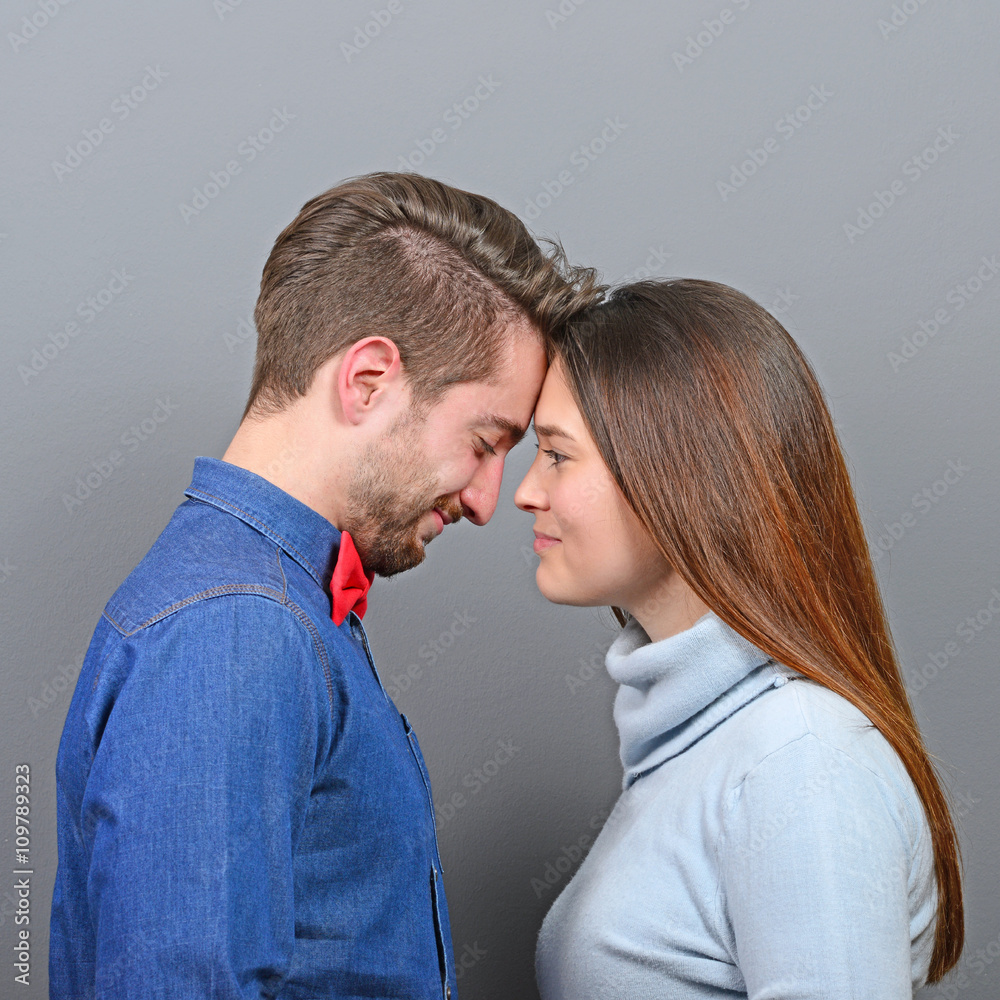 Happy couple in love looking deeply into each others eyes agains Happy couple in love looking deeply into each others eyes agains