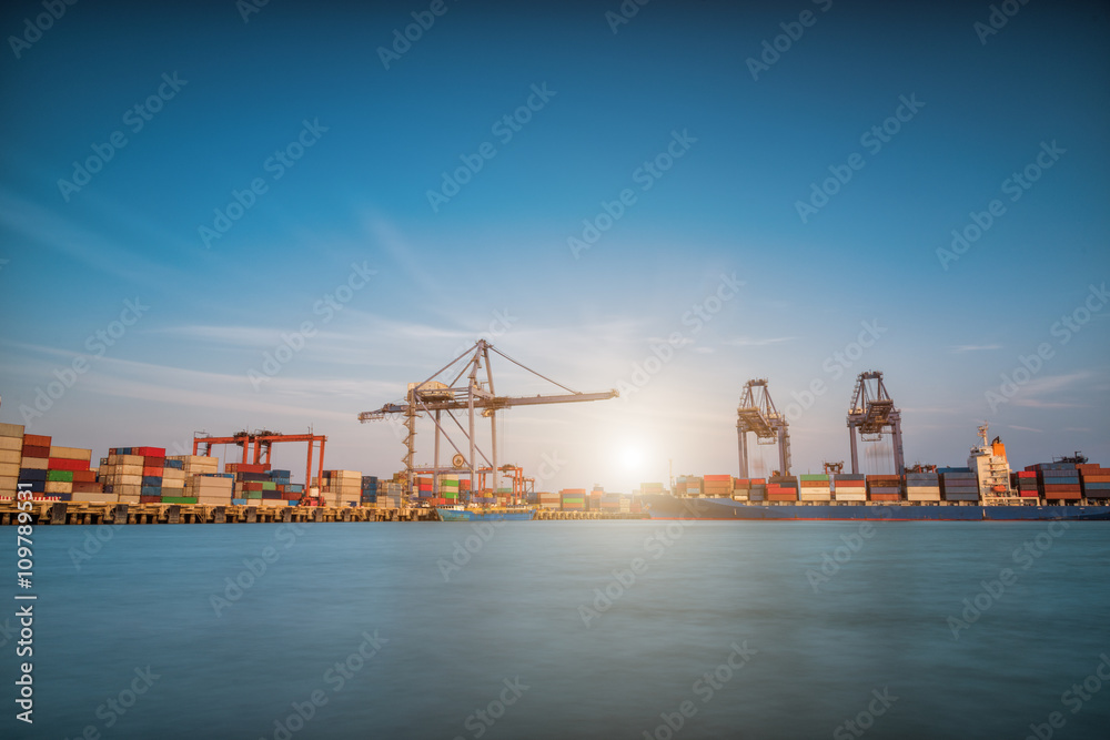 Cargo ship at Trade Port harbor with crane
