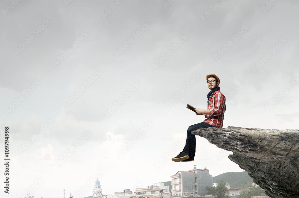 Hipster guy with book in hands Hipster guy with book in hands