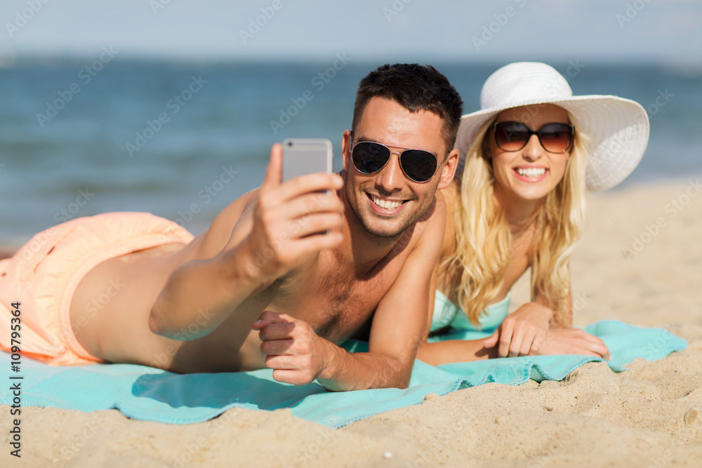 happy couple in swimwear walking on summer beach happy couple in swimwear walking on summer beach