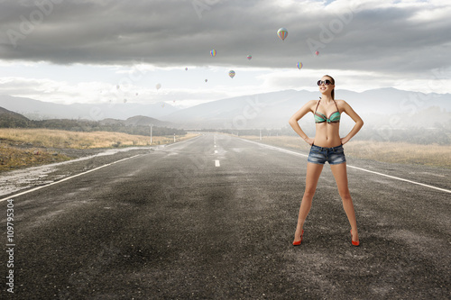 Hitch hiker woman on road