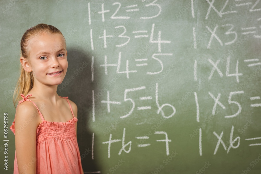 Girl standing in front of blackboard Girl standing in front of blackboard