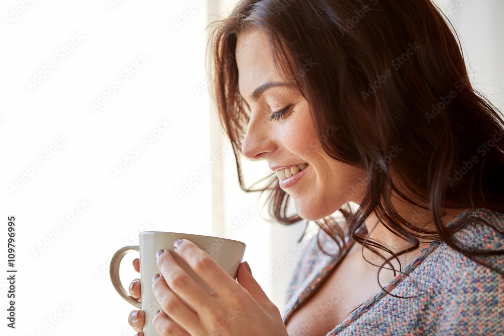 happy woman with cup of tea or coffee at home happy woman with cup of tea or coffee at home