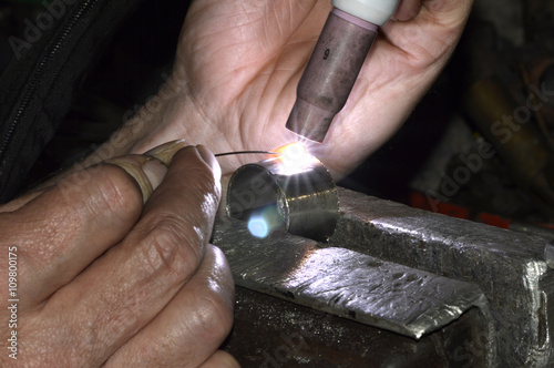 A person TIG welding