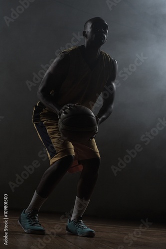 Portrait of basketball player preparing to score 