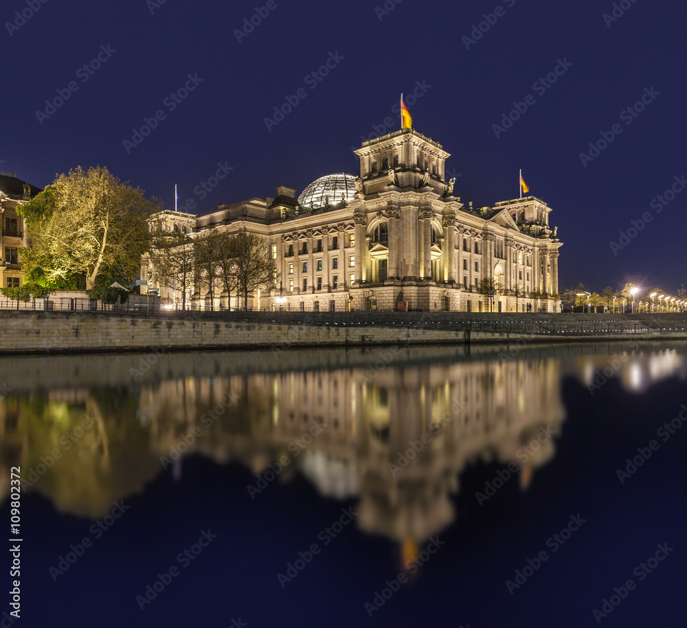  The german Reichstag by night with reflection in river spree