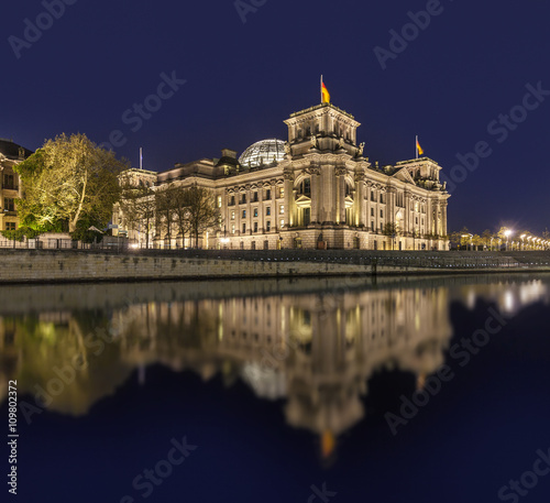  The german Reichstag by night with reflection in river spree