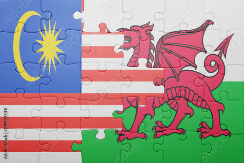 puzzle with the national flag of wales and malaysia