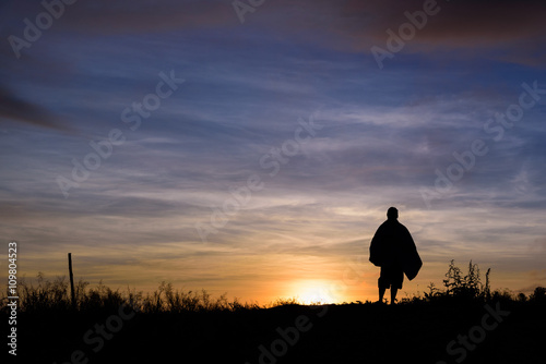 silhouette man in the morning light on the hill