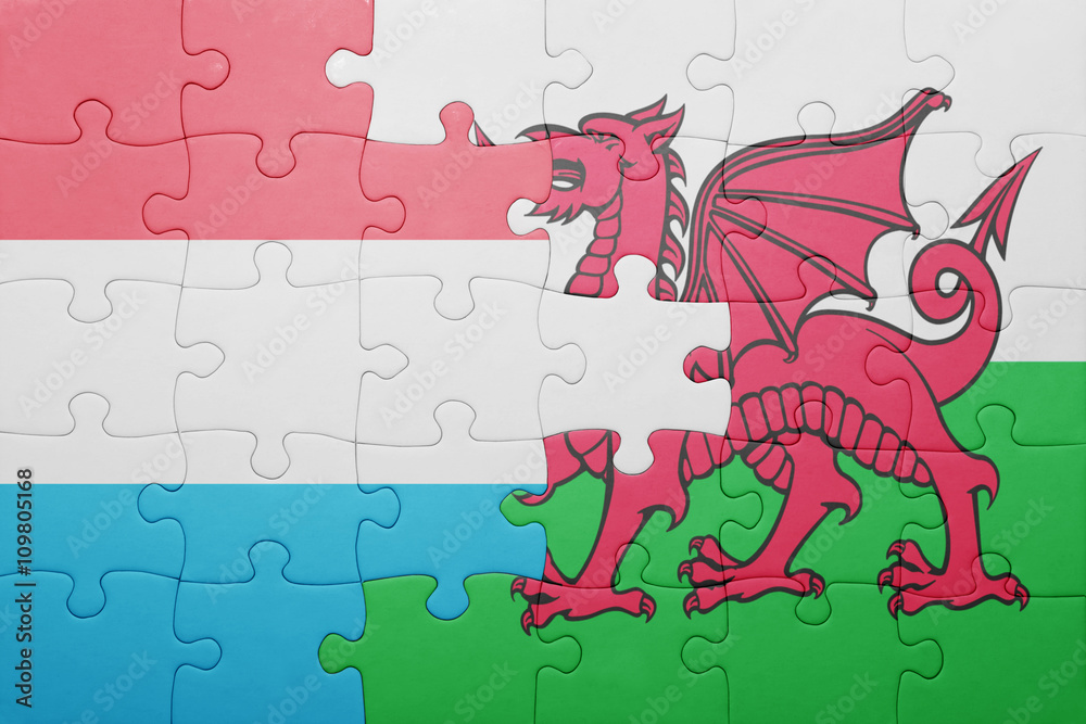 puzzle with the national flag of wales and luxembourg