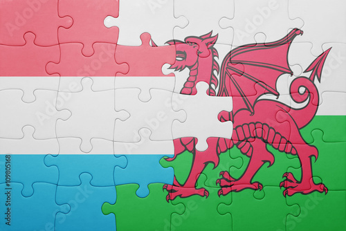 puzzle with the national flag of wales and luxembourg