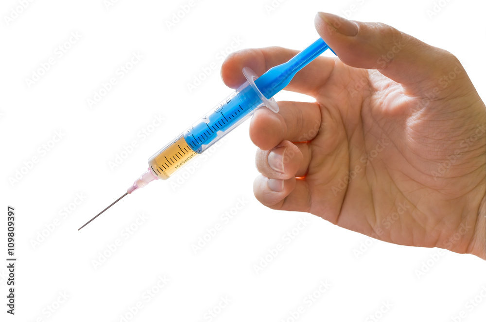 Hand holds syringe. Vaccination concept. Isolated on white background. Hand holds syringe. Vaccination concept. Isolated on white background.