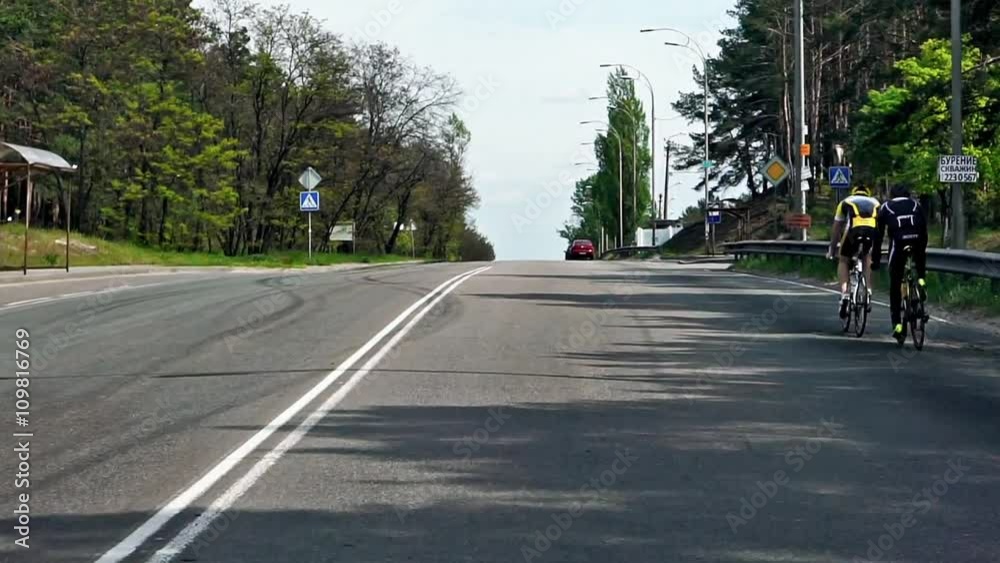 Kiev, Ukraine - May 1, 2016: Car riding through the forest to the sea restyled Kiev, Ukraine - May 1, 2016: Car riding through the forest to the sea restyled