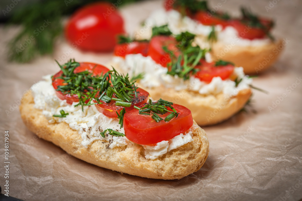 Delicious bruschetta with tomatoes, feta cheese, dill and spice