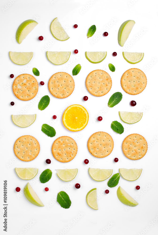 Food pattern of cookies with mint and lime on a white background