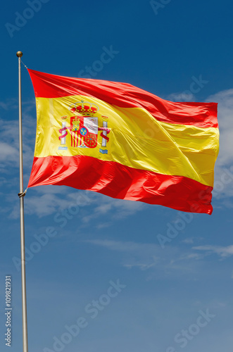 Spain flag waving on the sky