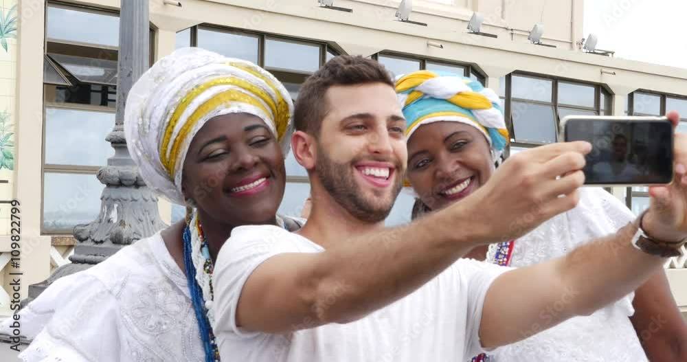 Tourist taking a selfie with a Baiana on Lacerda Elevator, Salvador, Bahia Tourist taking a selfie with a Baiana on Lacerda Elevator, Salvador, Bahia