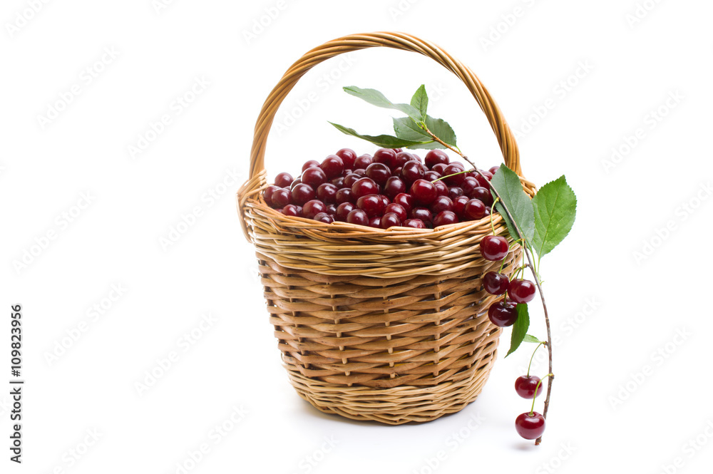 Basket full of fresh red cherry on a white background Basket full of fresh red cherry on a white background