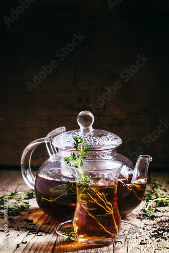 Middle East Black tea with thyme, ethnic glass and glass teapot,