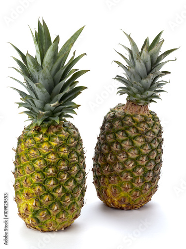 two pineapples on white