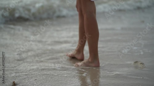 Wallpaper Mural woman walking barefoot on beach Torontodigital.ca