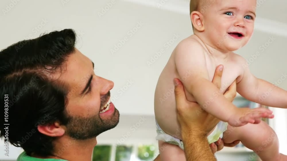 Happy father playing with cute baby boy Happy father playing with cute baby boy
