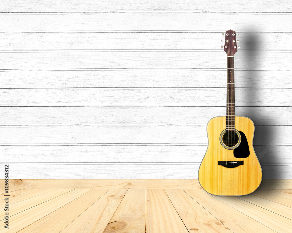 Obraz premium Acoustic guitar in vintage wood room.