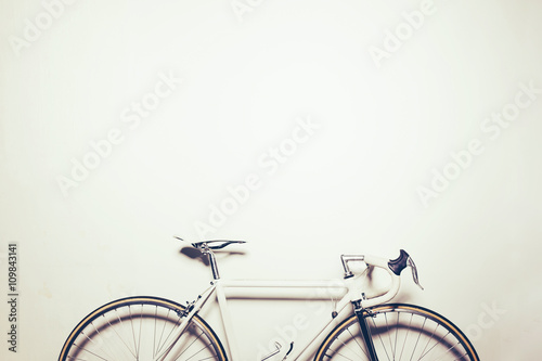 White vintage bicycle on white background