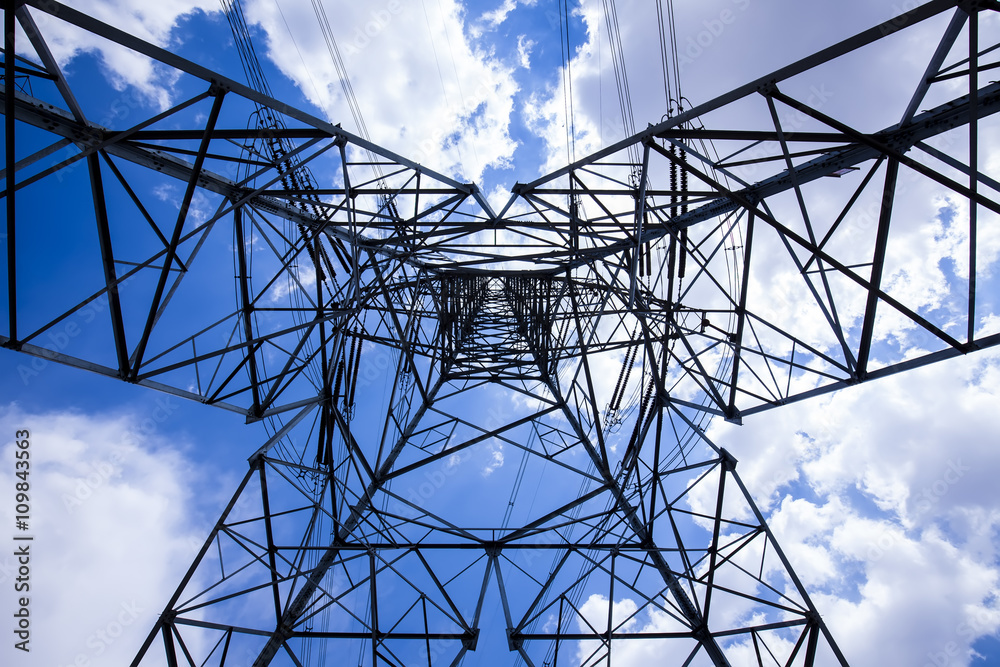 Pylon under the blue sky white clouds