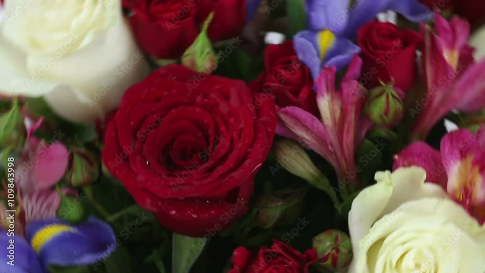 Beautiful bouquet roses, iris and alstroemeria quickly rotating. Beautiful bouquet roses, iris and alstroemeria quickly rotating.