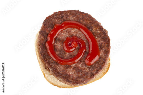 burger bun with patty and ketchup