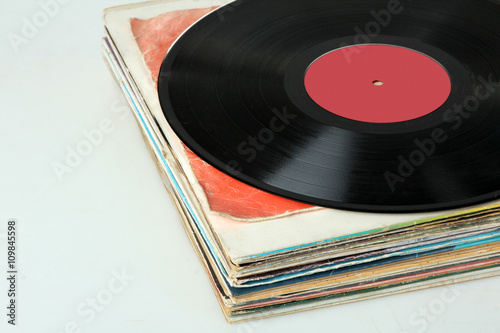 vinyl record on colorful packages isolated on white background