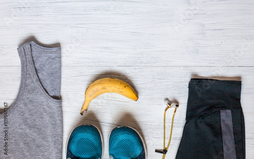 Clothing and fashion accessories on wooden table