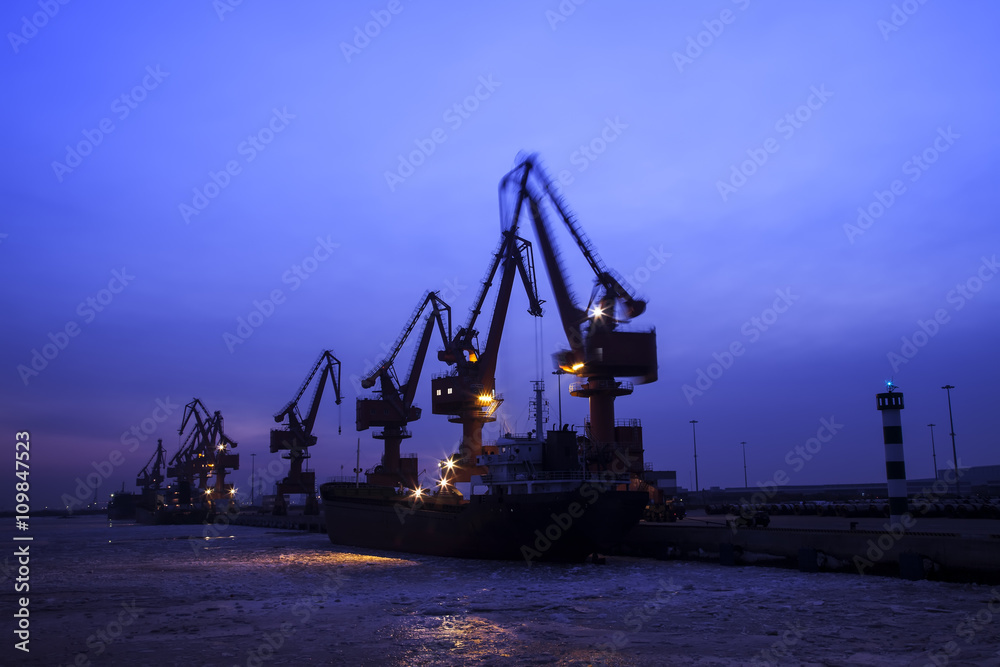 Cargo wharf crane at night