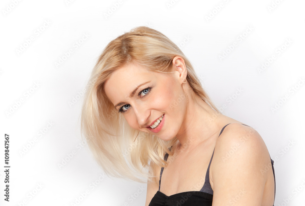 Young attractive blonde with bare shoulders smiling Young attractive blonde with bare shoulders smiling