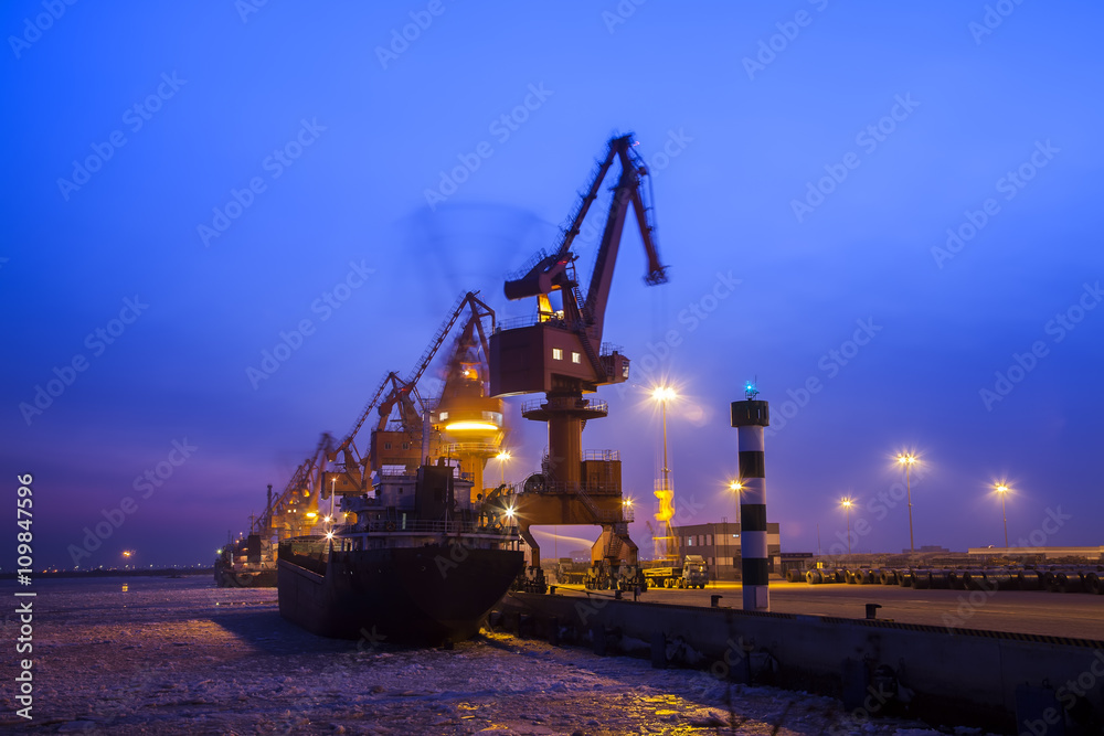 Cargo wharf crane at night