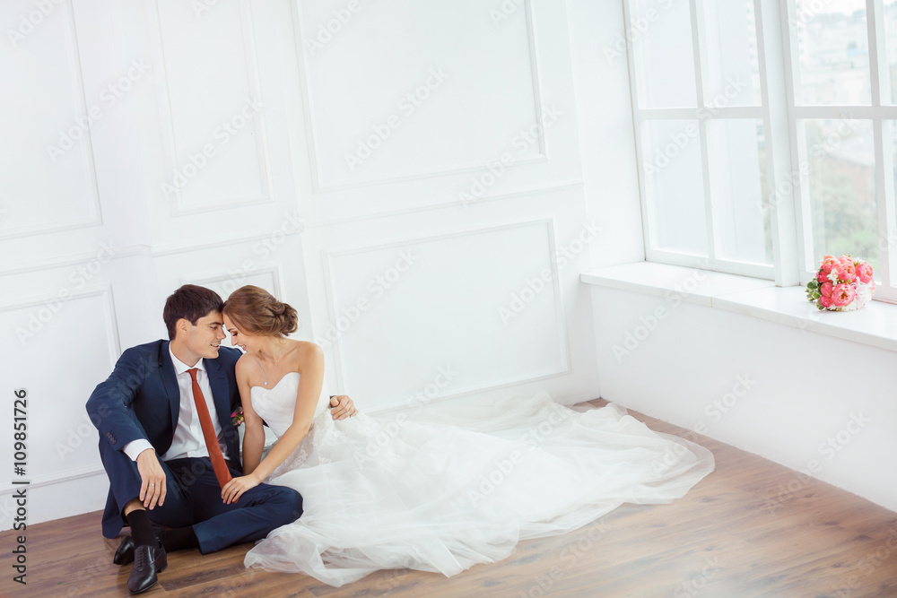 Bride and groom in very bright room