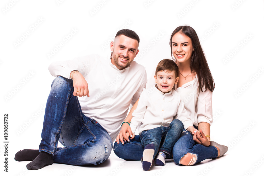 Happy young family with pretty child posing on white background Happy young family with pretty child posing on white background