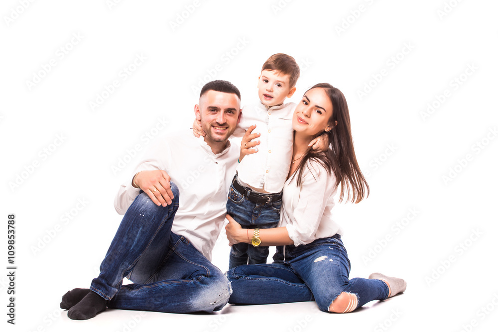 happy family mother and father with son sitting on the floor on white happy family mother and father with son sitting on the floor on white