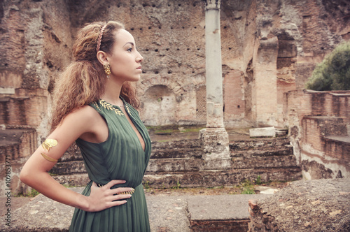 Beautiful woman  near ancient ruins...