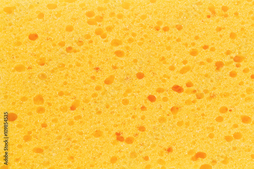 yellow sponge with porous texture background
