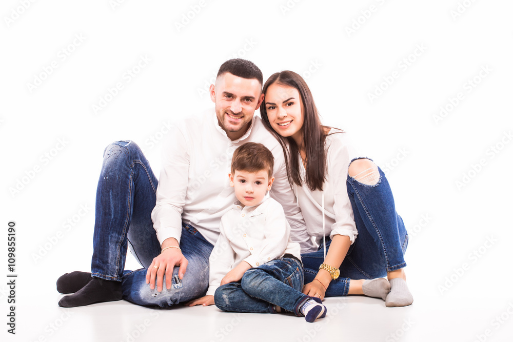 happy family mother, father and son sitting on the floor on white happy family mother, father and son sitting on the floor on white