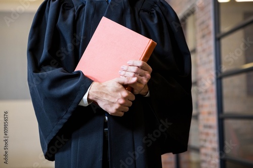 Lawyer holding a law book