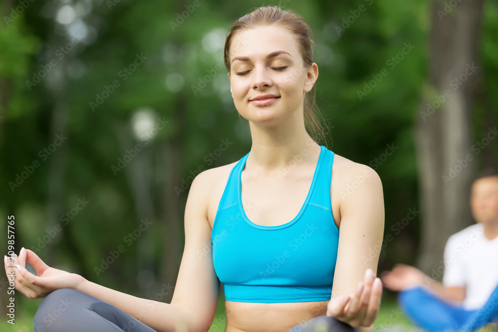 Fototapeta premium Having yoga practice in park