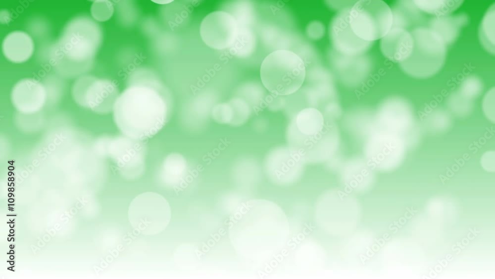Abstract moving white bokeh on green background