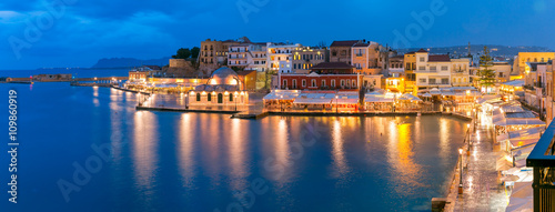 Picturesque panoramic view of Venetian quay of Chania with Kucuk Hasan Pasha Mosque during twilight blue hour, Crete, Greece photo
