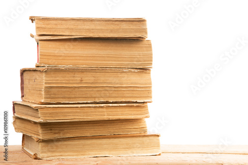 Stack of old and used hardback books or text books isolated