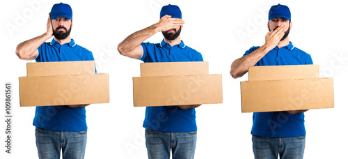 Delivery man covering his eyes