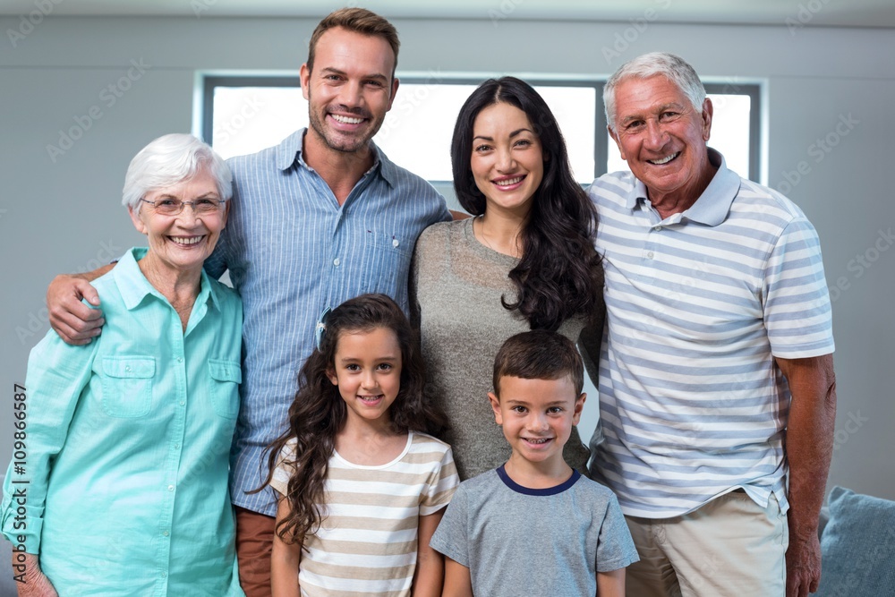 Happy family standing together and smiling Happy family standing together and smiling