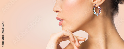 close up of beautiful woman face with earring